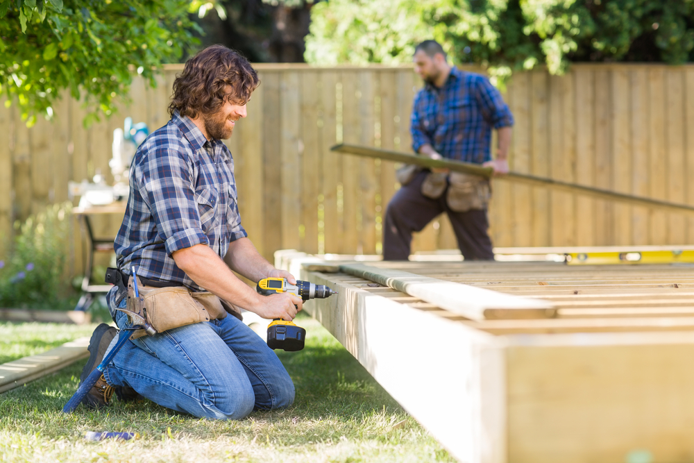 homeowners building a deck in their yard.