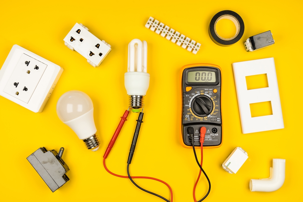 electrical tools on a yellow background.